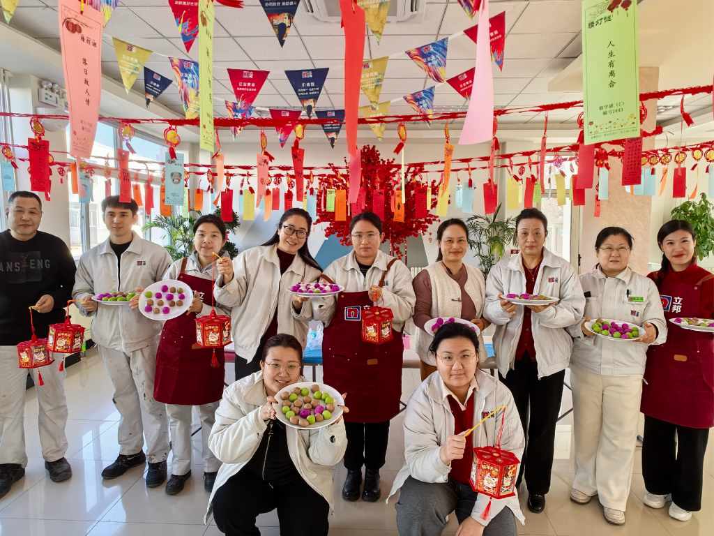 Nippon Paint China employees making and sharing tangyuan, a symbol of family unity, for the Lantern Festival. 