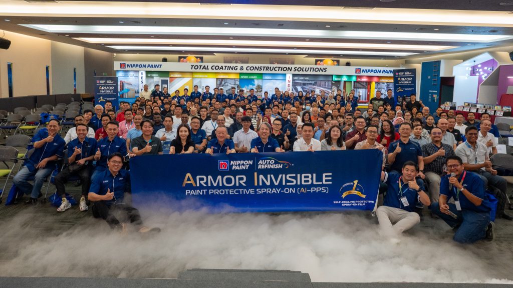 A group photo of the Nippon Paint Malaysia Auto Refinish team gathering to celebrate the new product launch.