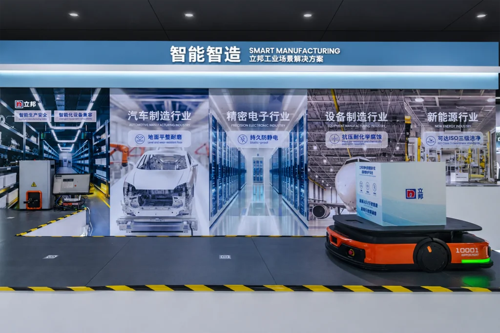 A smart manufacturing exhibition display featuring automated logistics equipment.