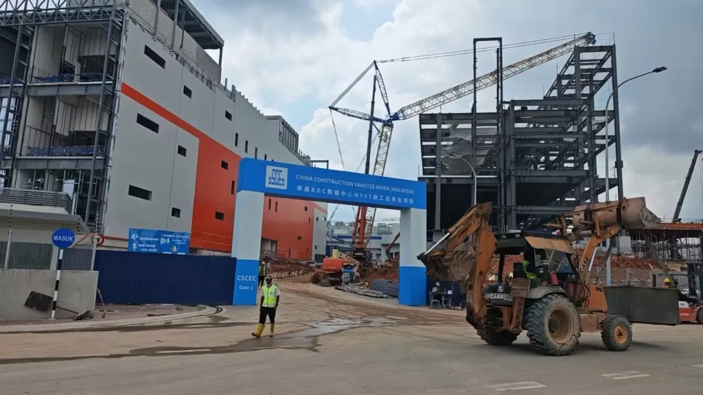 Construction vehicles and cranes operating at the BDC M07 Data Center site.